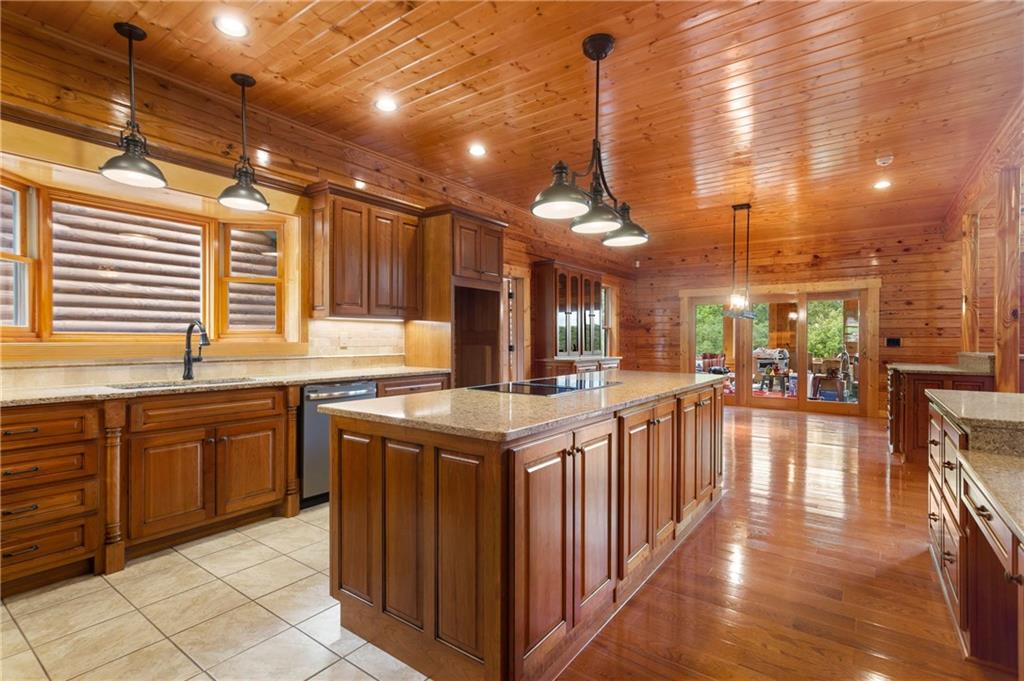 729 Huckleberry Way Jasper, GA 30143 - Photo 34 of 74 a kitchen with lots of counter top space and wooden floor