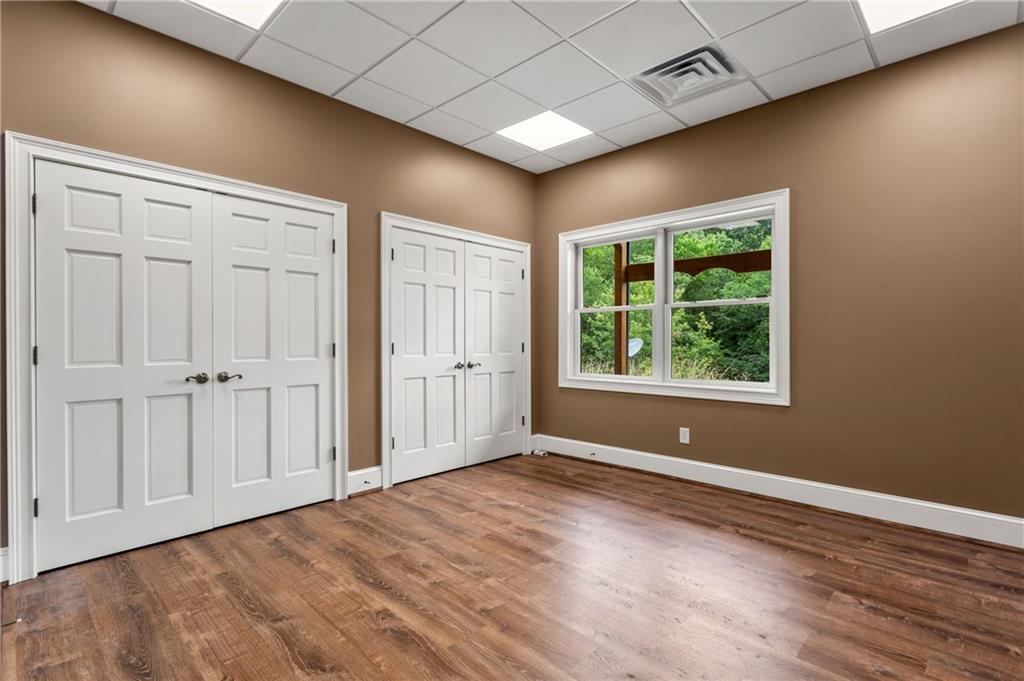 729 Huckleberry Way Jasper, GA 30143 - Photo 52 of 74 an empty room with wooden floor and windows