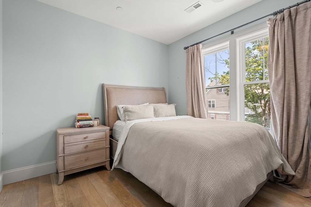 251 Minot Street, Unit 6 Boston, MA 02124 - Photo 18 of 30 a bedroom with a bed and a window