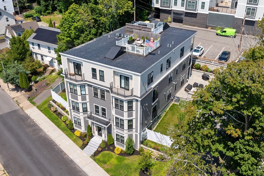 251 Minot Street, Unit 6 Boston, MA 02124 - Photo 2 of 30 aerial view of a house with swimming pool
