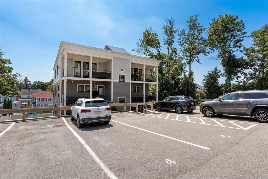 251 Minot Street, Unit 6 Boston, MA 02124 - Photo 29 of 30 a car parked in front of a house