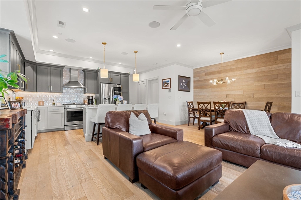 251 Minot Street, Unit 6 Boston, MA 02124 - Photo 5 of 30 a living room with furniture and a wooden floor