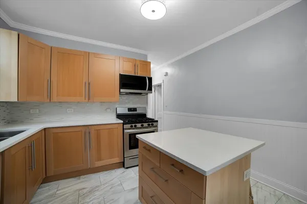 a kitchen with a stove and a sink