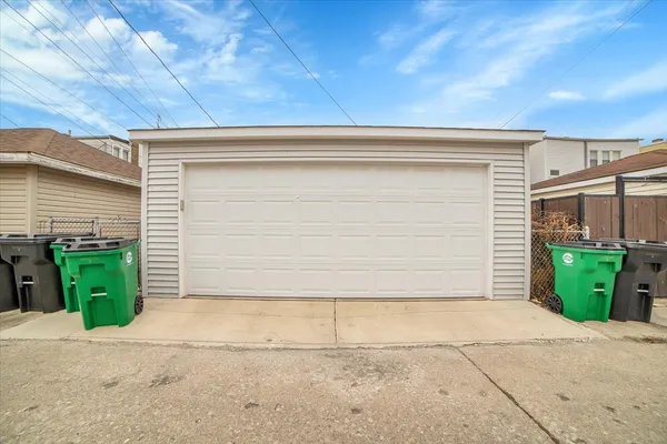 a front view of a house with green space