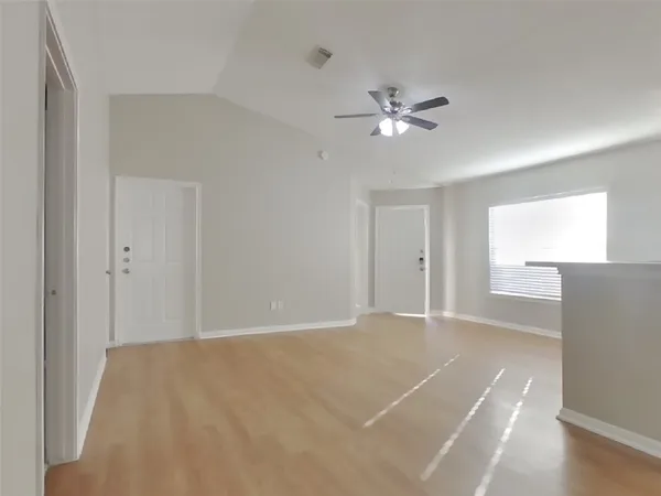 a view of an empty room with a window