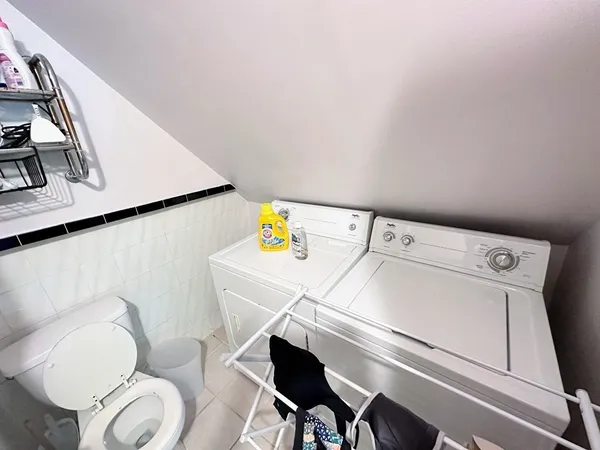 a utility room with dryer and washer