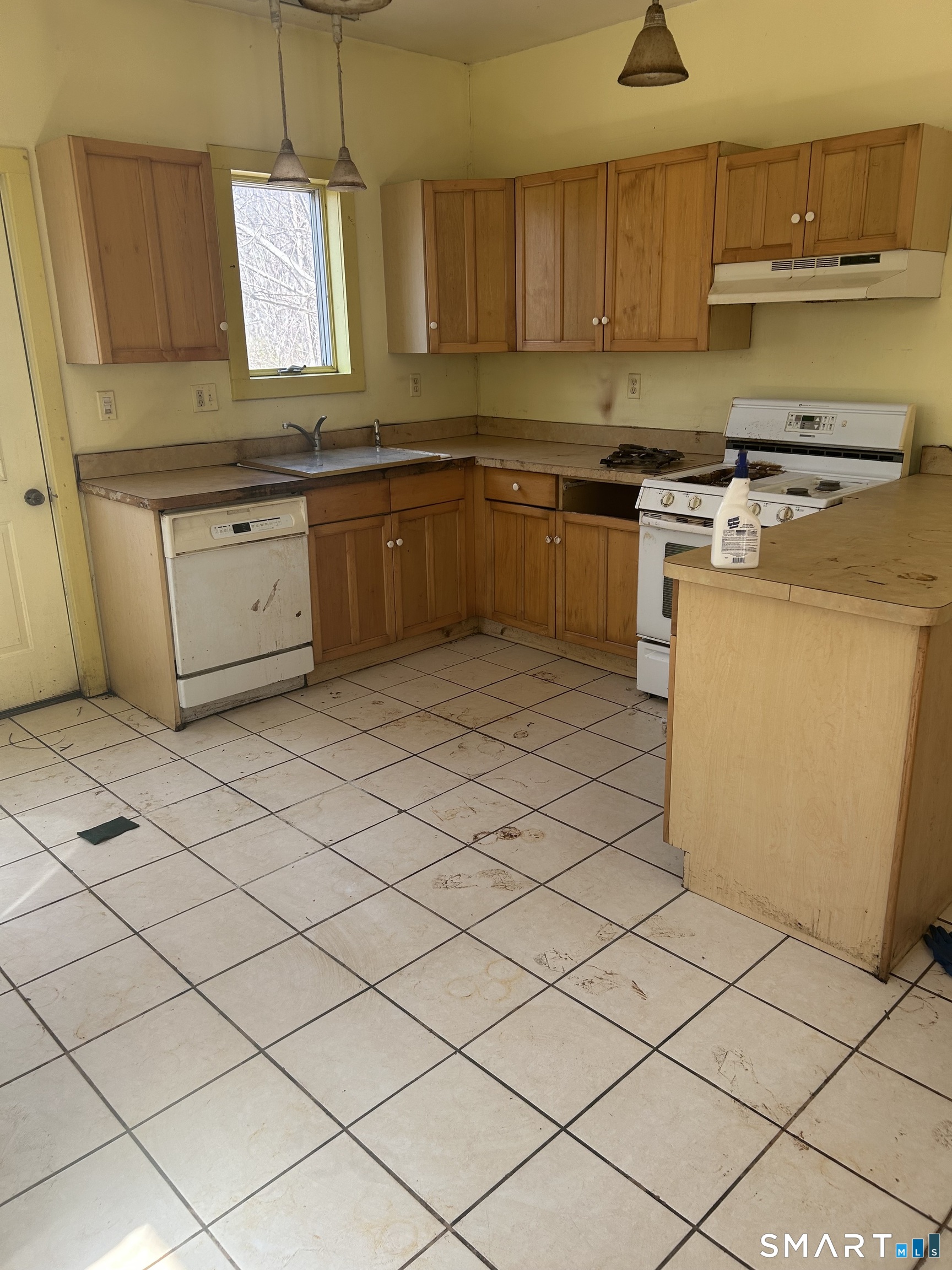 134 Sillimanville Road East Haddam, CT 06469 - Photo 24 of 27 a kitchen with stainless steel appliances granite countertop a stove a sink and a refrigerator