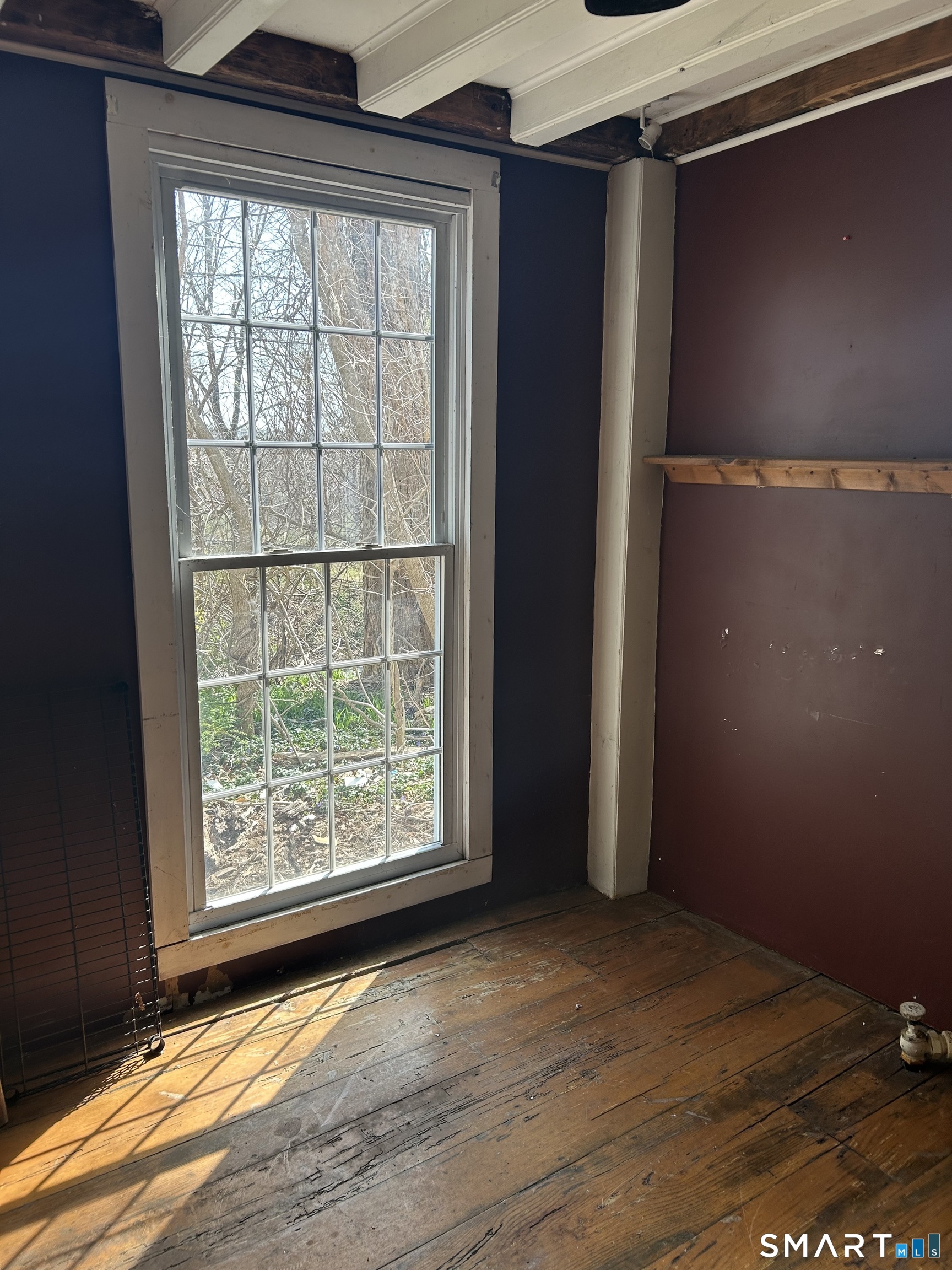 134 Sillimanville Road East Haddam, CT 06469 - Photo 7 of 27 an empty room with wooden floor and windows