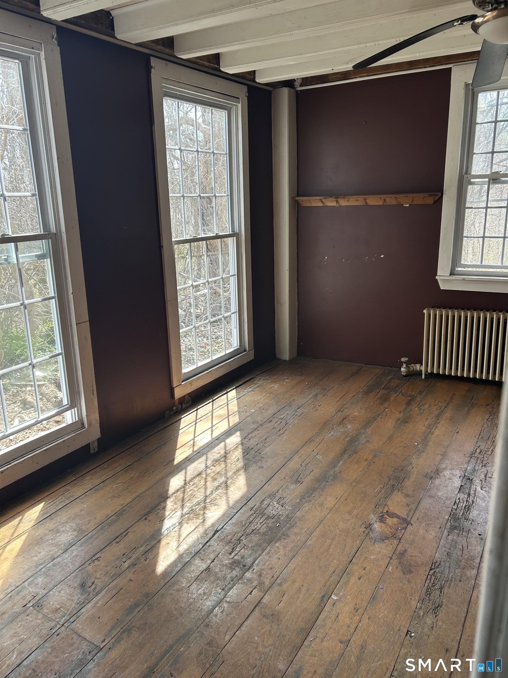 134 Sillimanville Road East Haddam, CT 06469 - Photo 8 of 27 an empty room with wooden floor and windows