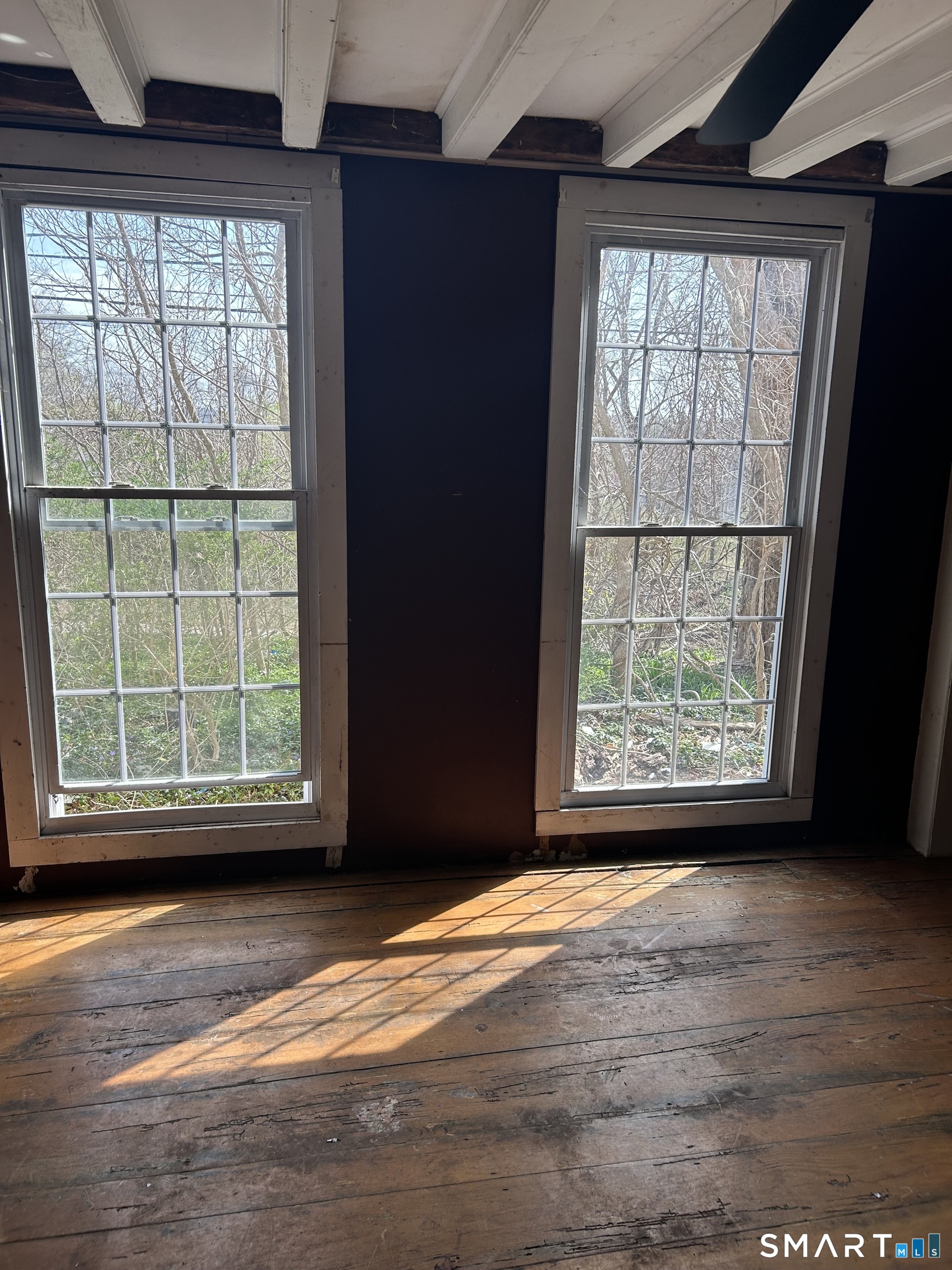 134 Sillimanville Road East Haddam, CT 06469 - Photo 10 of 27 an empty room with wooden floor and windows
