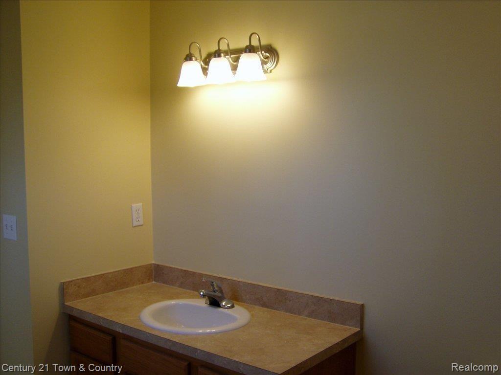 3257 East 11 Mile Road, Unit 8 Warren, MI 48092 - Photo 9 of 12 VANITY IN MASTER BATH