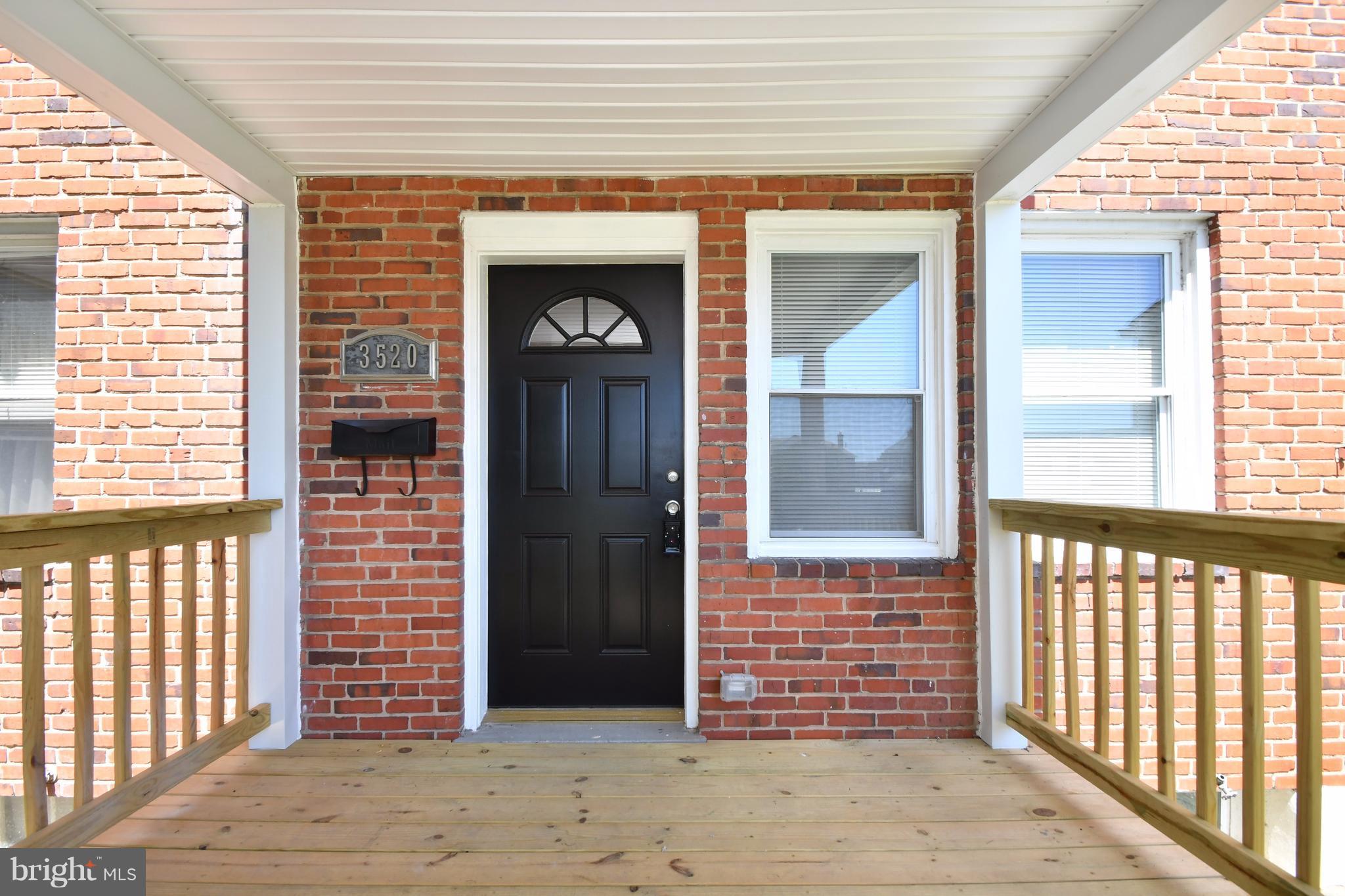 3520 Dunhaven Road Baltimore, MD 21222 - Photo 2 of 30 a front view of a house with a porch