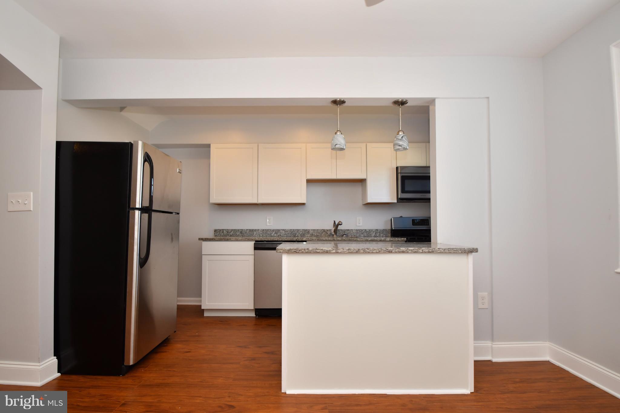 3520 Dunhaven Road Baltimore, MD 21222 - Photo 12 of 30 a kitchen with stainless steel appliances granite countertop a refrigerator a stove and a sink