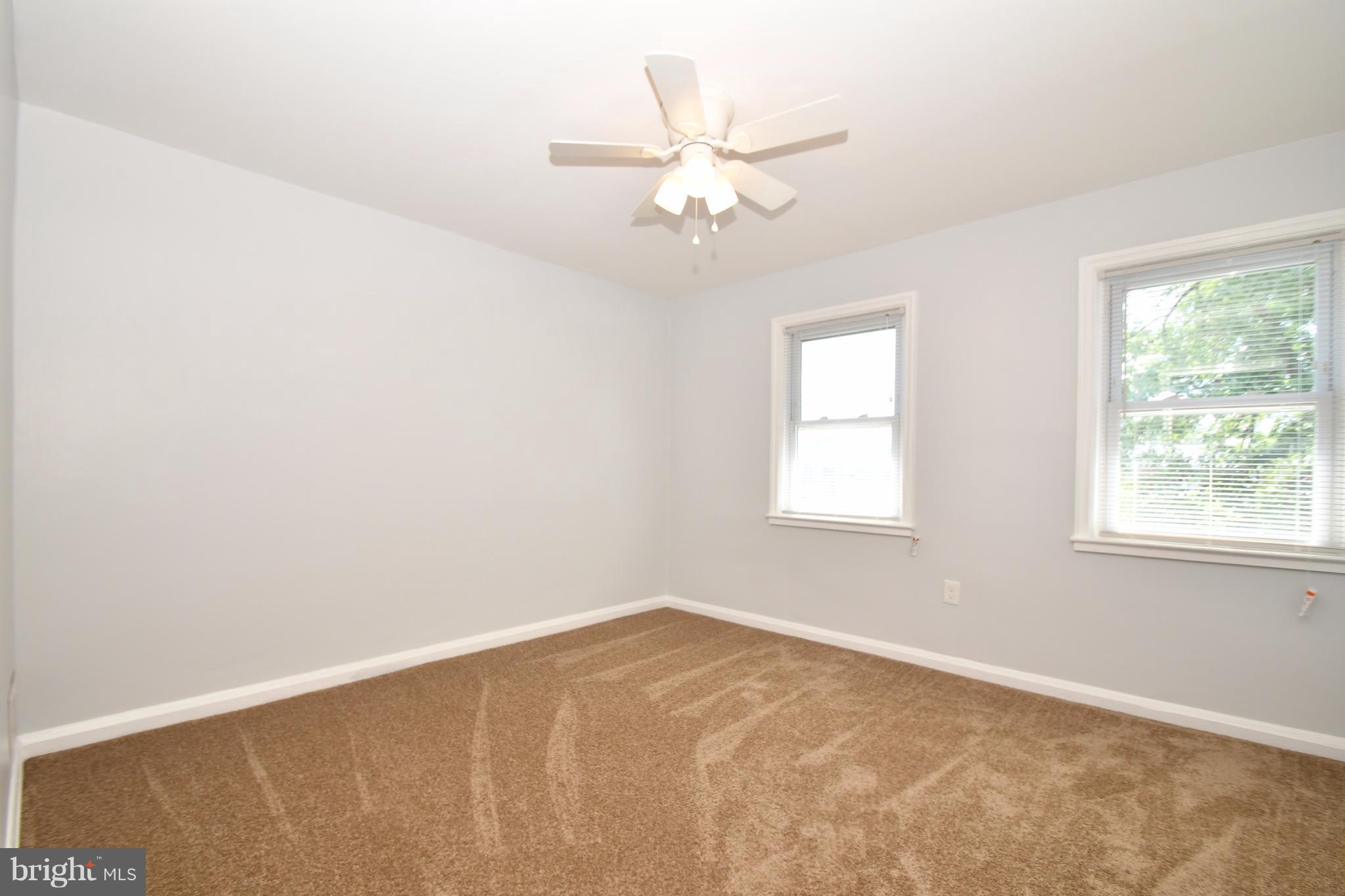 3520 Dunhaven Road Baltimore, MD 21222 - Photo 16 of 30 an empty room with windows and fan