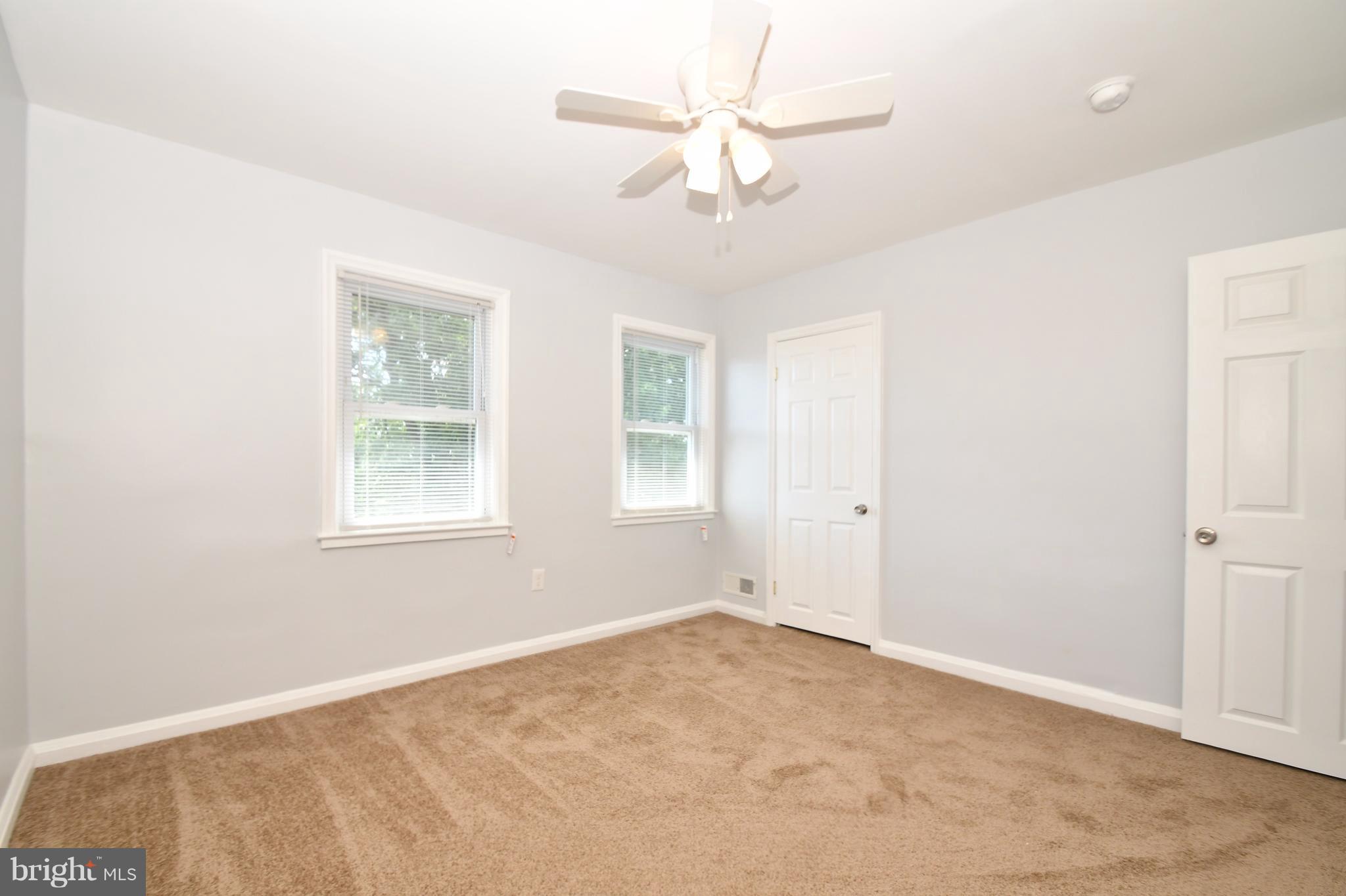 3520 Dunhaven Road Baltimore, MD 21222 - Photo 19 of 30 an empty room with windows and fan