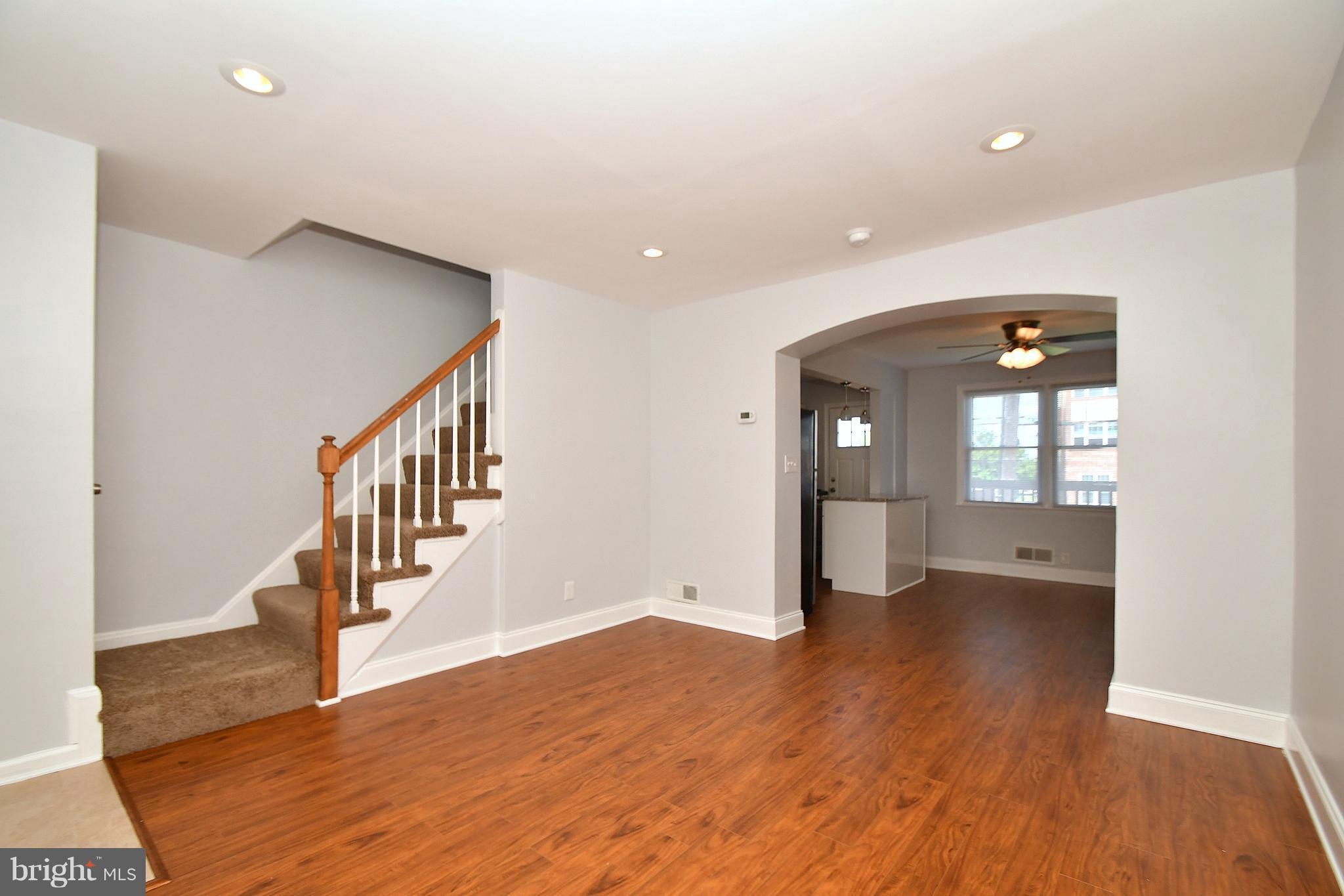 3520 Dunhaven Road Baltimore, MD 21222 - Photo 3 of 30 wooden floor in an empty room with a window