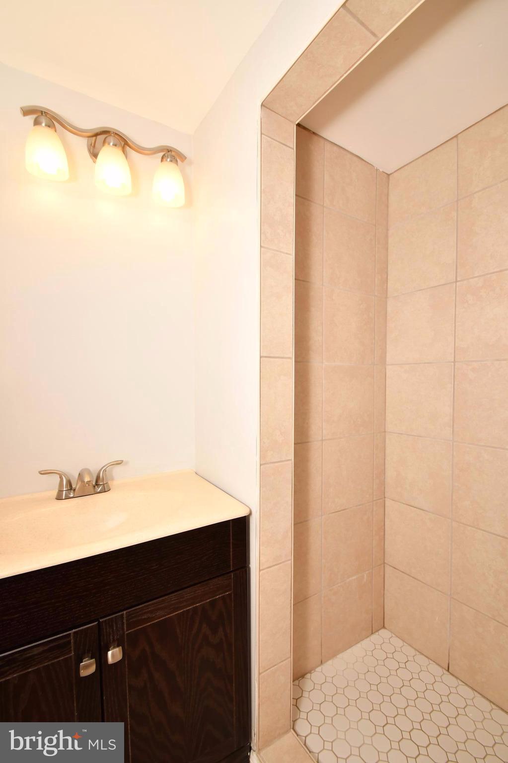 3520 Dunhaven Road Baltimore, MD 21222 - Photo 25 of 30 a bathroom with a sink and a mirror