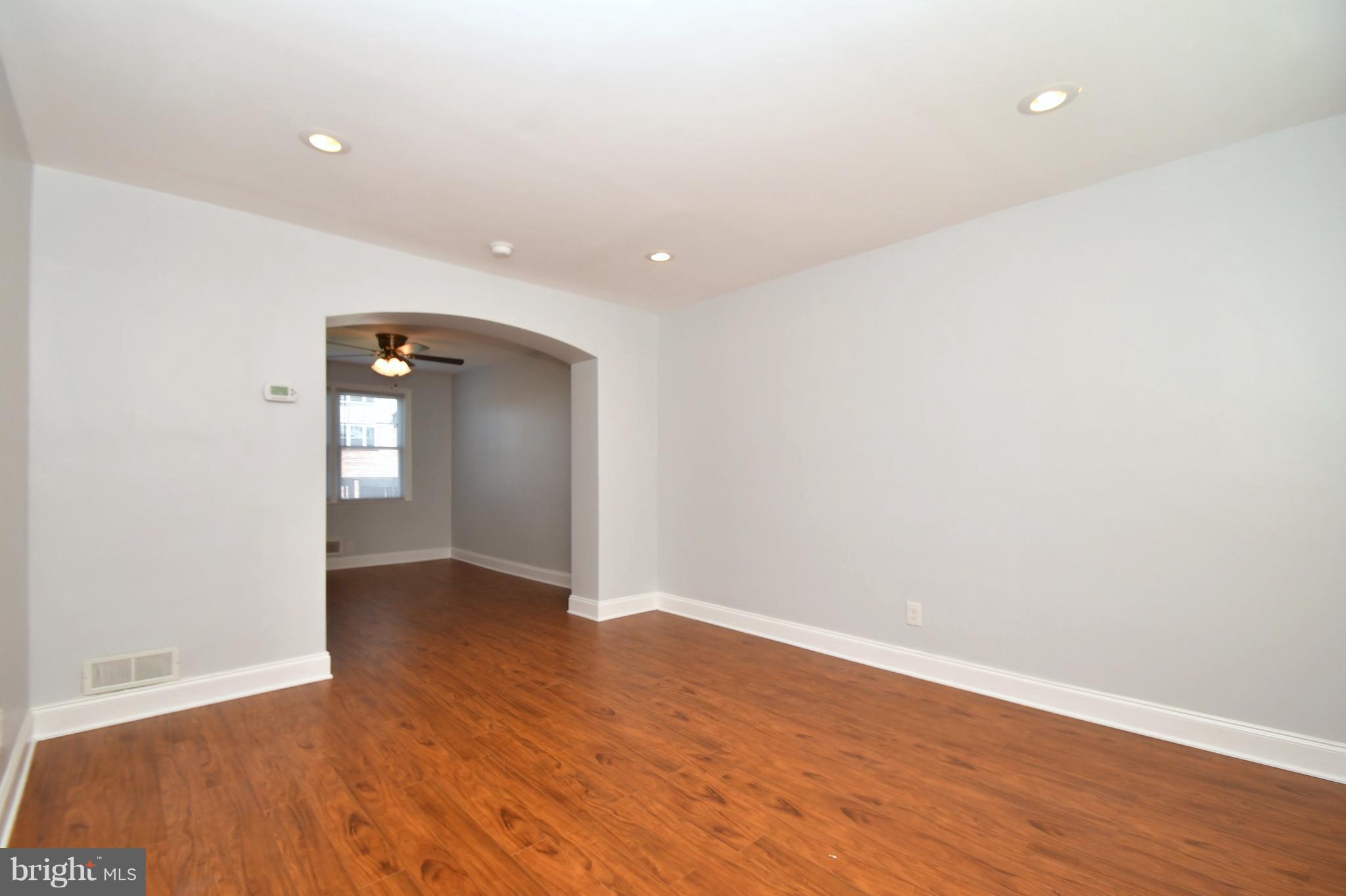 3520 Dunhaven Road Baltimore, MD 21222 - Photo 5 of 30 a view of an empty room with wooden floor and closet