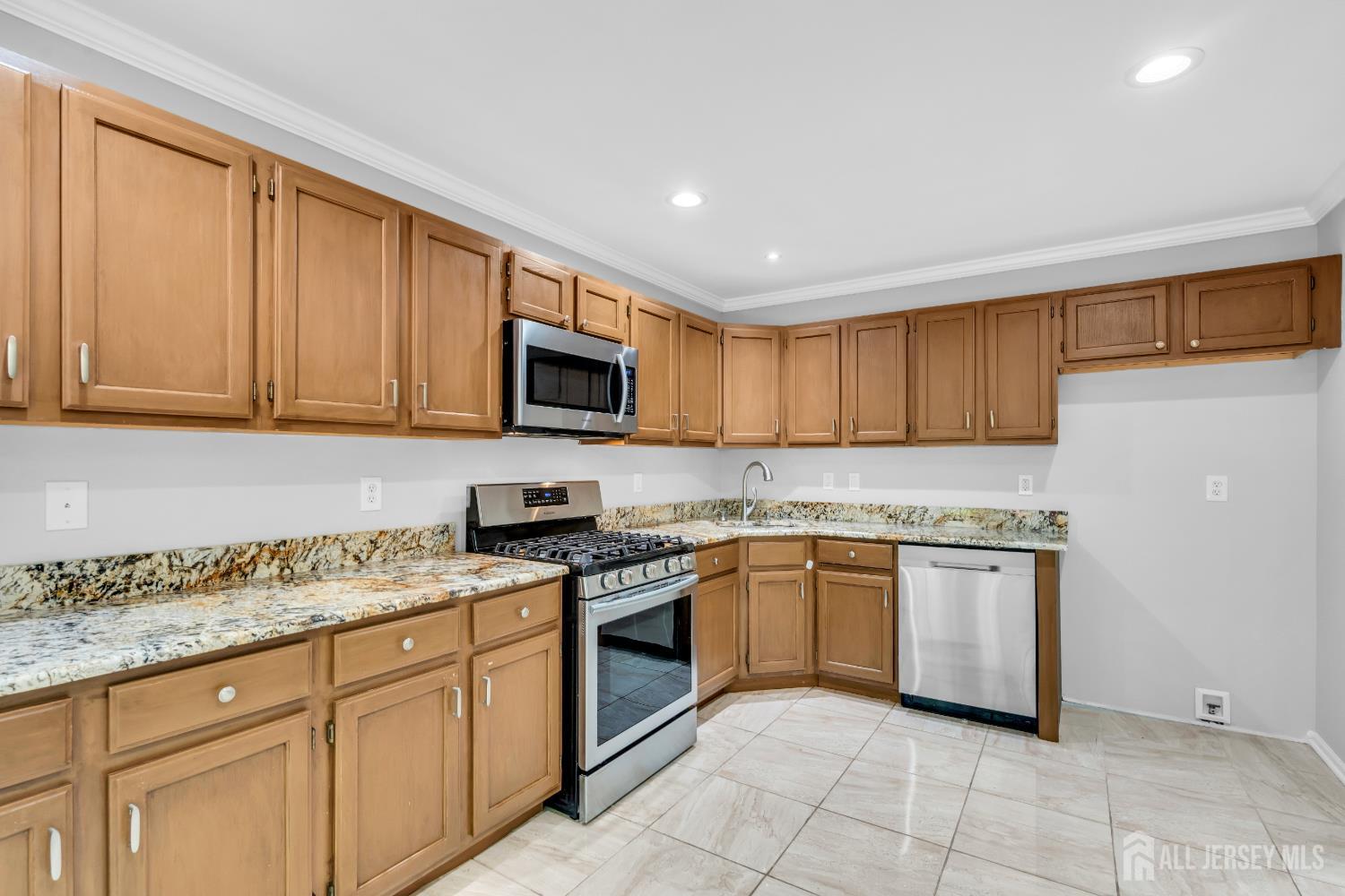 242 Hawthorne Road North Brunswick, NJ 08902 - Photo 11 of 34 a kitchen with granite countertop cabinets stainless steel appliances and a counter space
