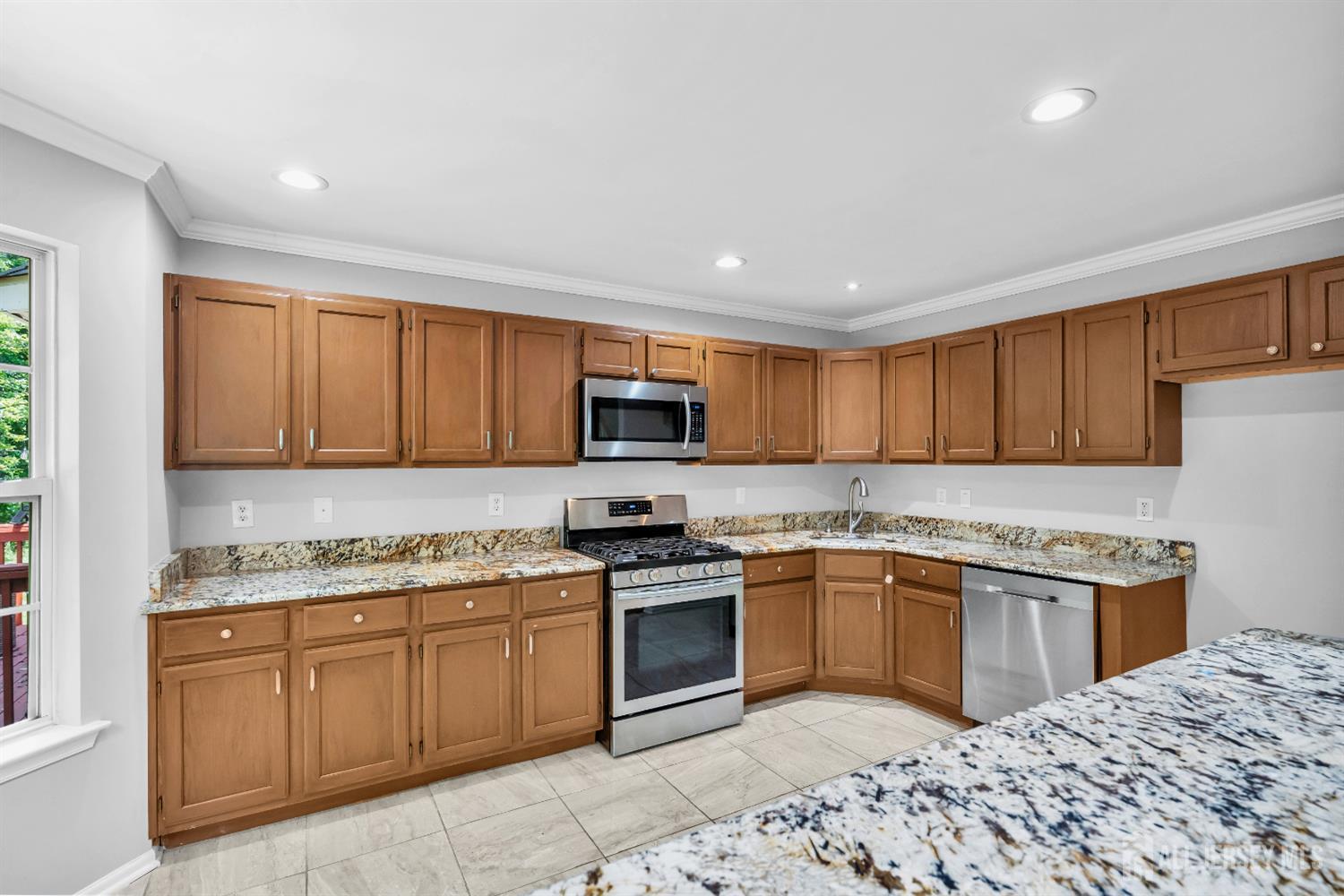 242 Hawthorne Road North Brunswick, NJ 08902 - Photo 13 of 34 a kitchen with a sink stove and cabinets