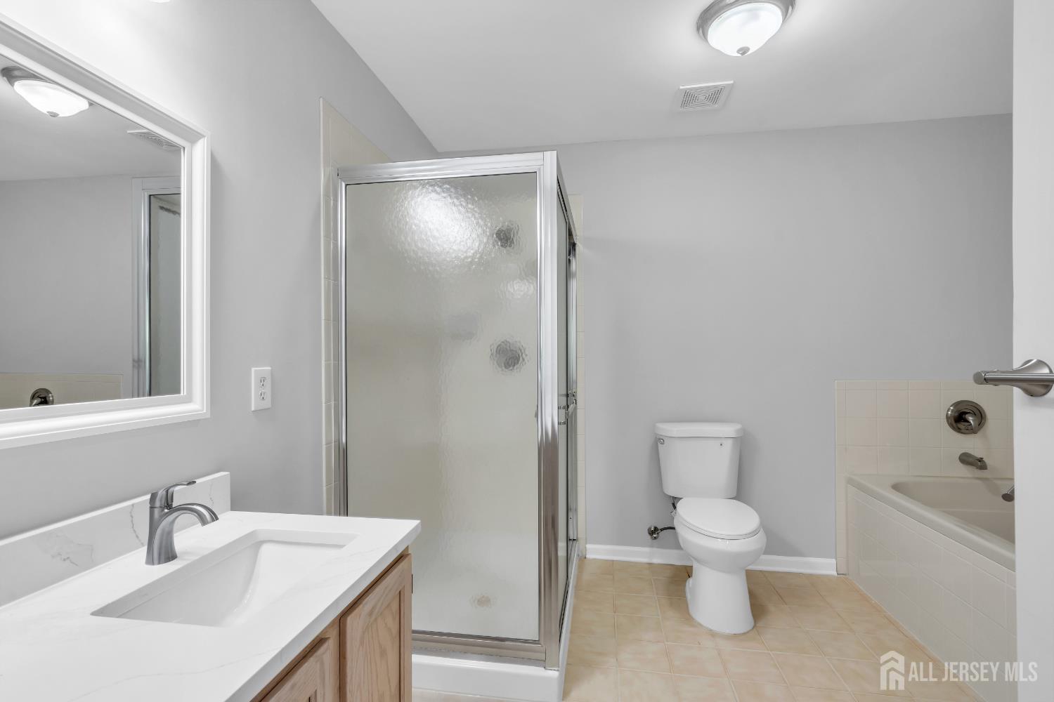 242 Hawthorne Road North Brunswick, NJ 08902 - Photo 25 of 34 a bathroom with a toilet sink and shower
