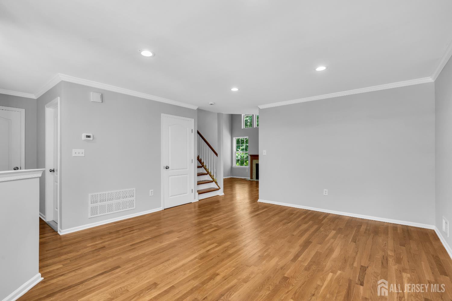242 Hawthorne Road North Brunswick, NJ 08902 - Photo 5 of 34 a view of an empty room with wooden floor and closet