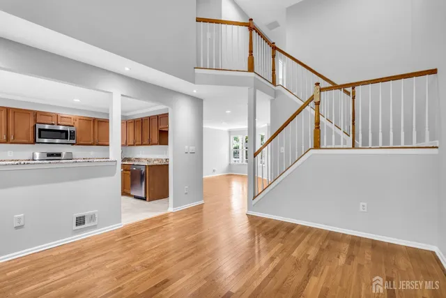a view of kitchen with cabinets and wooden floor