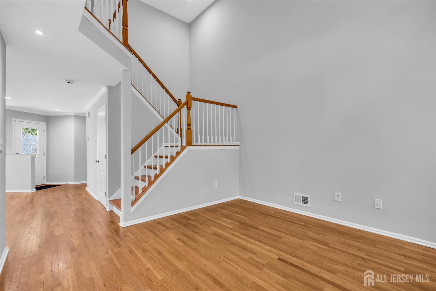 242 Hawthorne Road North Brunswick, NJ 08902 - Photo 9 of 34 a view of entryway and hall with wooden floor