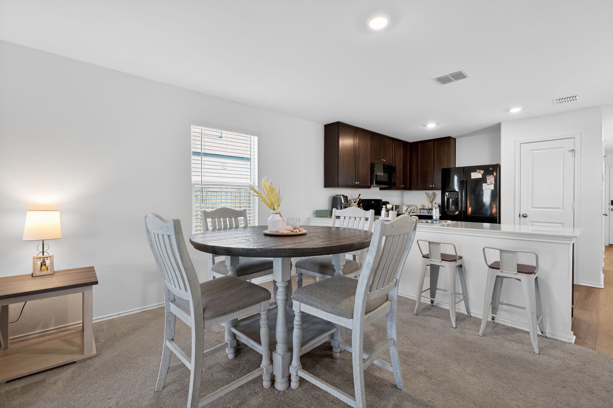 612 Marty Allen Loop Jarrell, TX 76537 - Photo 6 of 15 Dining space featuring light colored carpet and recessed lighting