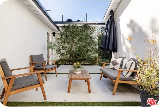 a building outdoor space with patio furniture