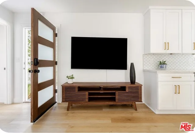 a view of kitchen with stainless steel appliances cabinets and counter space