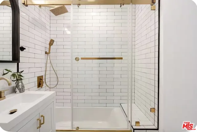 a bathroom with a sink and a shower