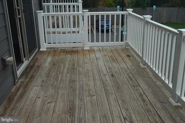 an empty room with wooden floor