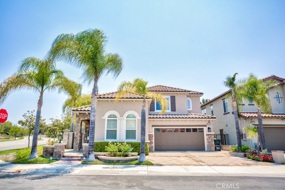 3782 Carson Way Yorba Linda, CA 92886 - Photo 1 of 48 a view of a white house with a small yard and palm trees