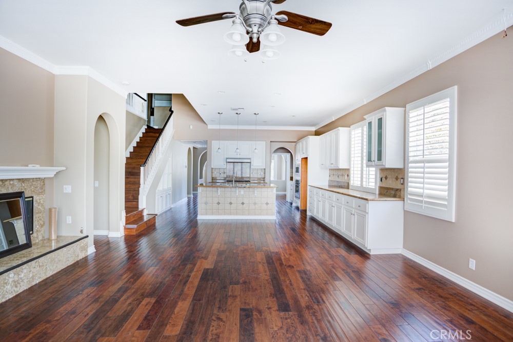 3782 Carson Way Yorba Linda, CA 92886 - Photo 24 of 48 a view of a living room with wooden floor and a ceiling fan