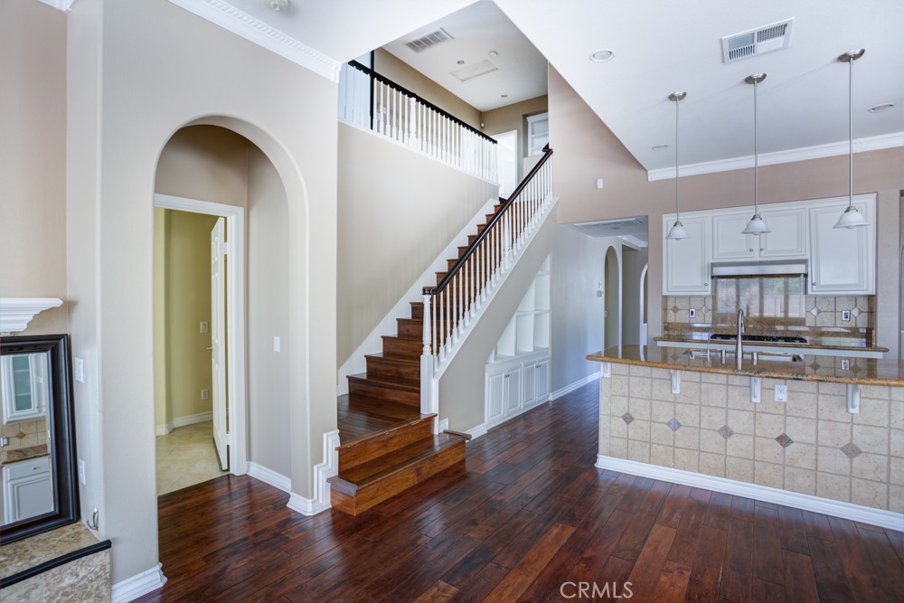 3782 Carson Way Yorba Linda, CA 92886 - Photo 25 of 48 a view of front door with hallway and wooden floor
