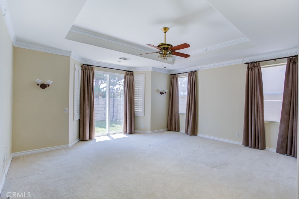 3782 Carson Way Yorba Linda, CA 92886 - Photo 26 of 48 a view of a hallway with a chandelier and a ceiling fan