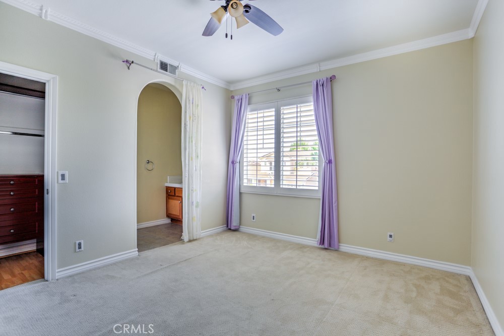 3782 Carson Way Yorba Linda, CA 92886 - Photo 34 of 48 an empty room with chandelier fan and windows