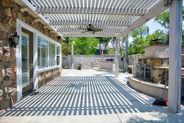 a view of a patio with a table chairs and a patio