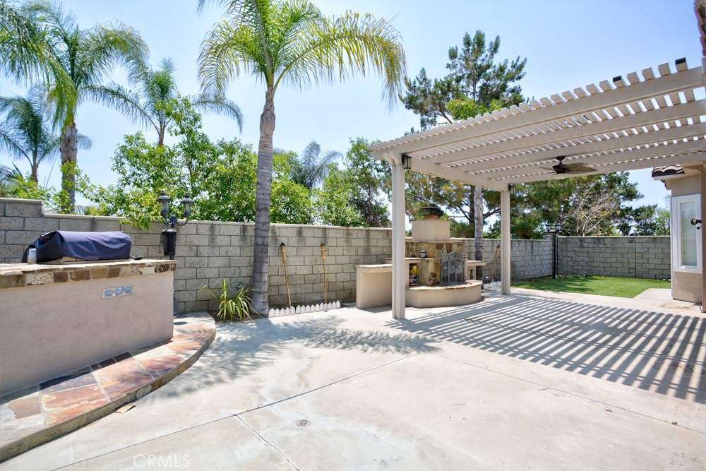 3782 Carson Way Yorba Linda, CA 92886 - Photo 48 of 48 a backyard of a house with lawn chairs plants and palm tree