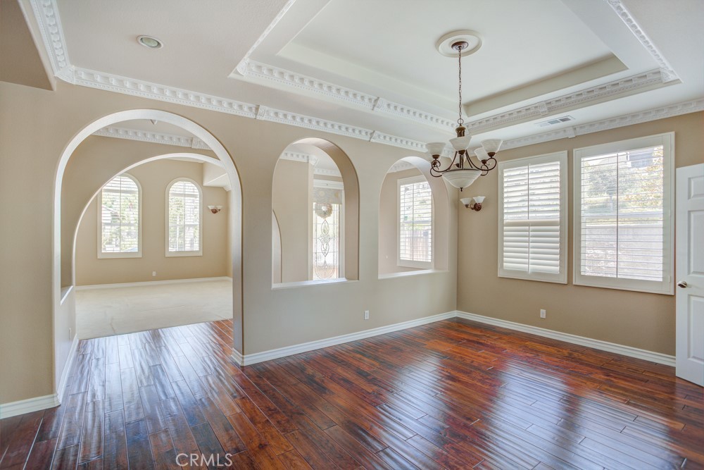 3782 Carson Way Yorba Linda, CA 92886 - Photo 8 of 48 a view of a room with wooden floors chandelier and glass door