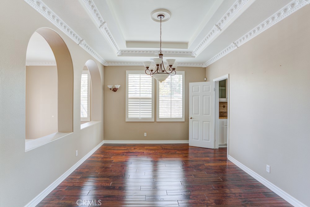 3782 Carson Way Yorba Linda, CA 92886 - Photo 10 of 48 a view of a room with wooden flooring and chandelier
