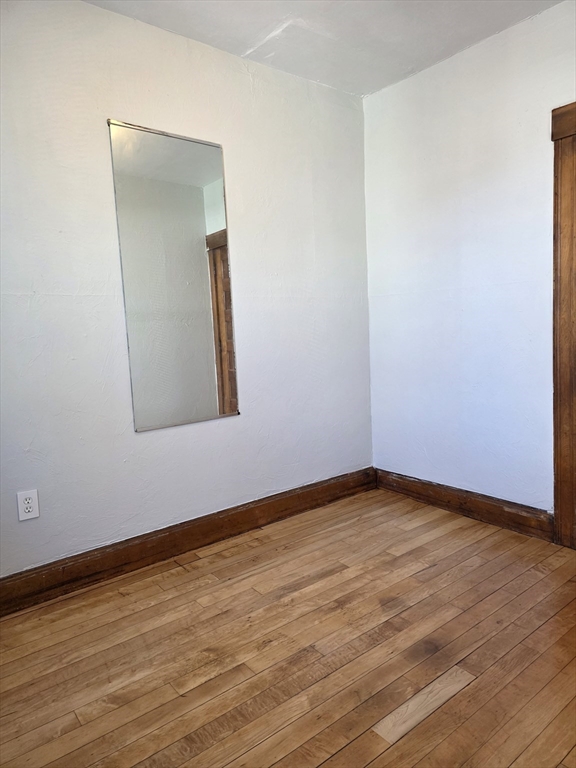 2 Hillside Street, Unit 3 Worcester, MA 01610 - Photo 12 of 23 a view of an empty room and wooden floor