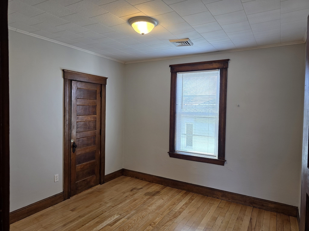 2 Hillside Street, Unit 3 Worcester, MA 01610 - Photo 13 of 23 an empty room with windows
