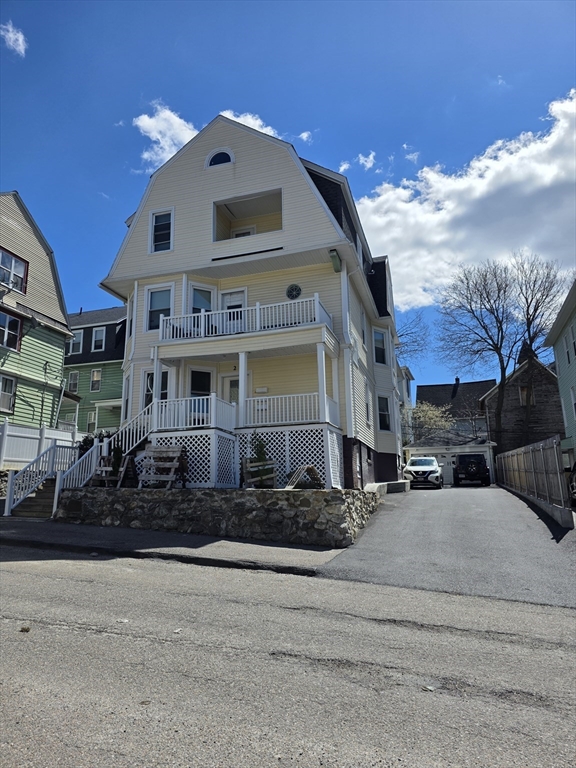 2 Hillside Street, Unit 3 Worcester, MA 01610 - Photo 2 of 23 a front view of a house with a yard