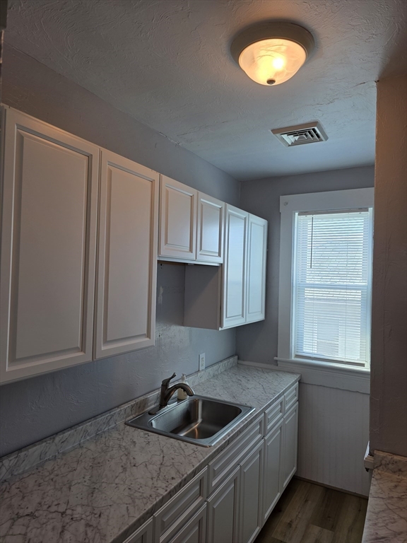 2 Hillside Street, Unit 3 Worcester, MA 01610 - Photo 3 of 23 a kitchen with a sink and cabinets