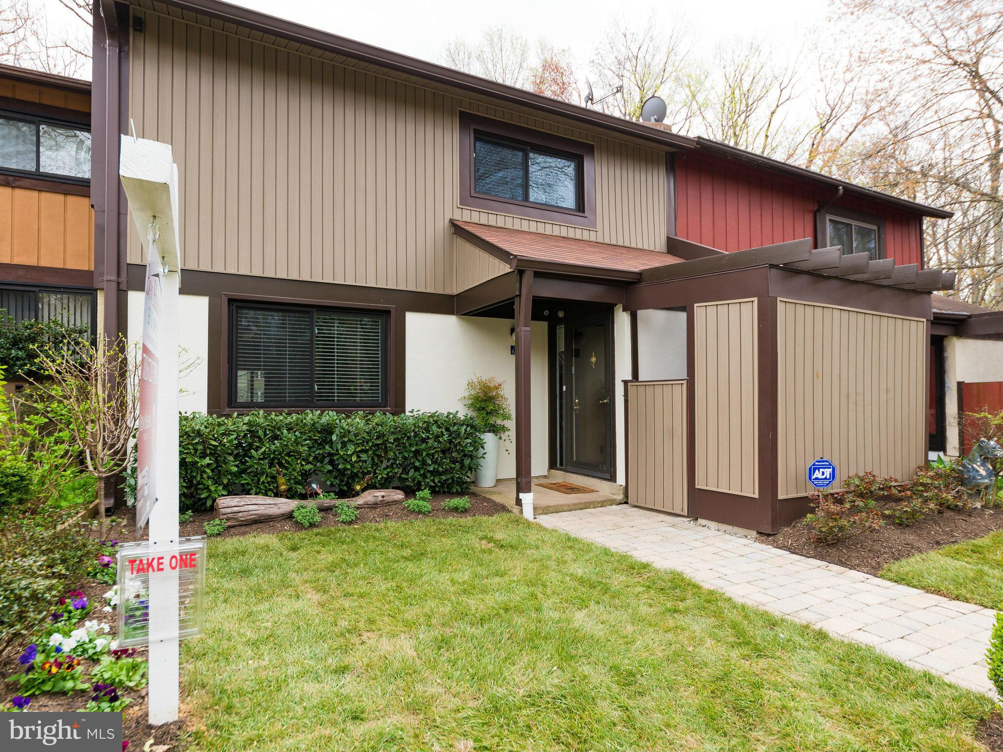 2269 Wheelwright Court Reston, VA 20191 - Photo 2 of 28 a front view of a house with a yard