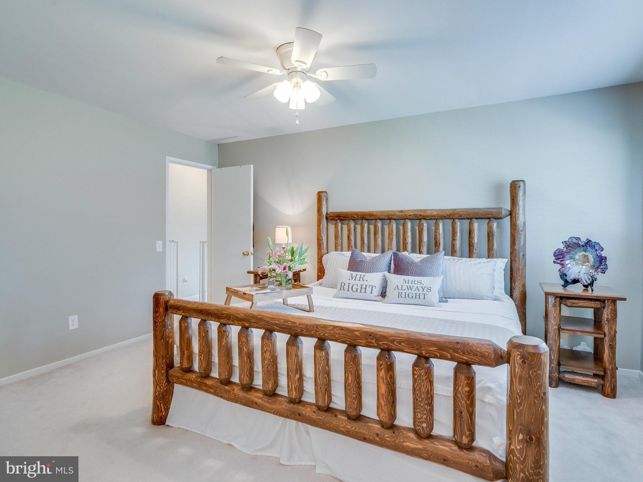 2269 Wheelwright Court Reston, VA 20191 - Photo 13 of 28 a bed room with a bed and a chandelier