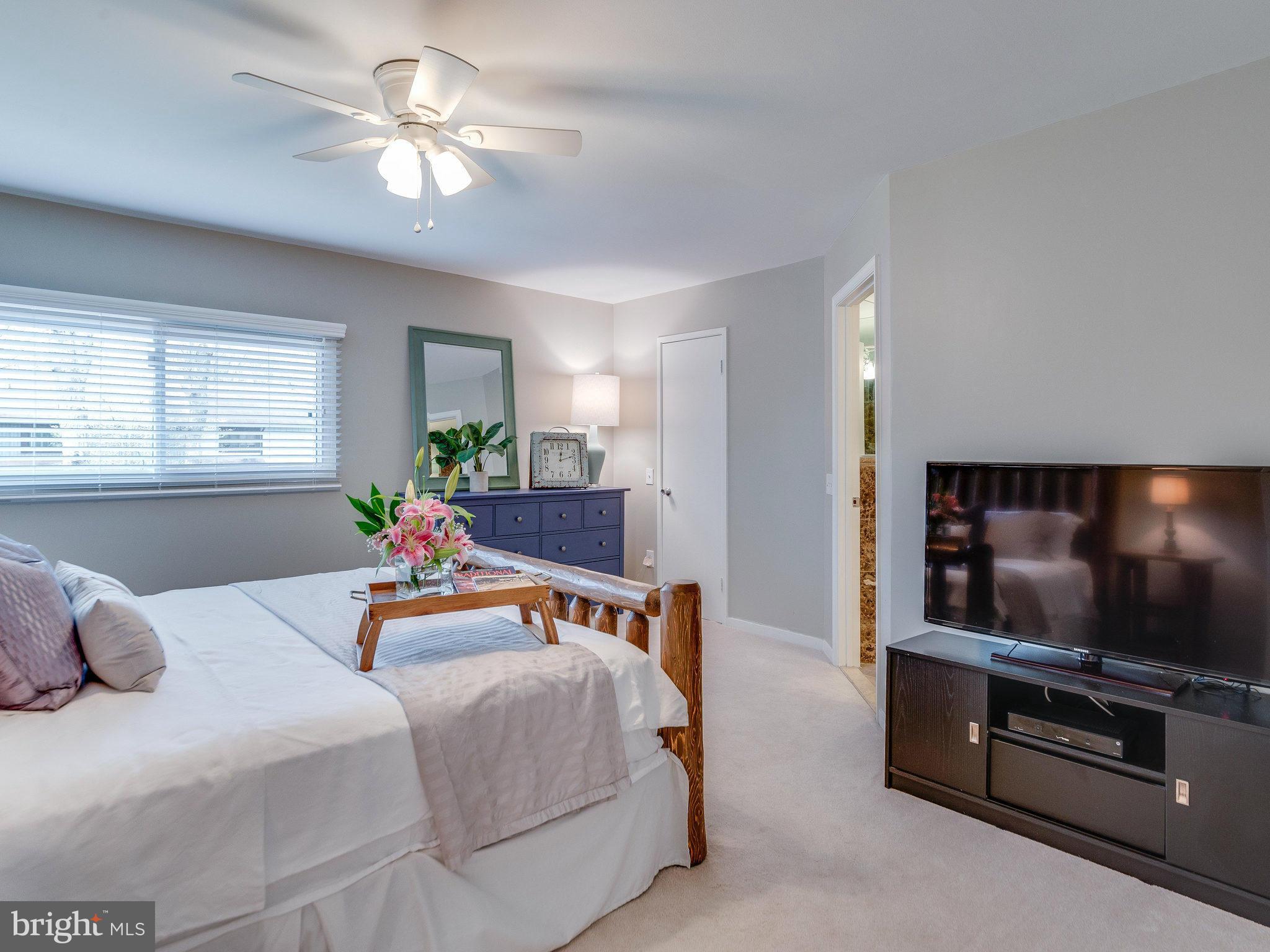 2269 Wheelwright Court Reston, VA 20191 - Photo 14 of 28 a bedroom with furniture and a flat screen tv
