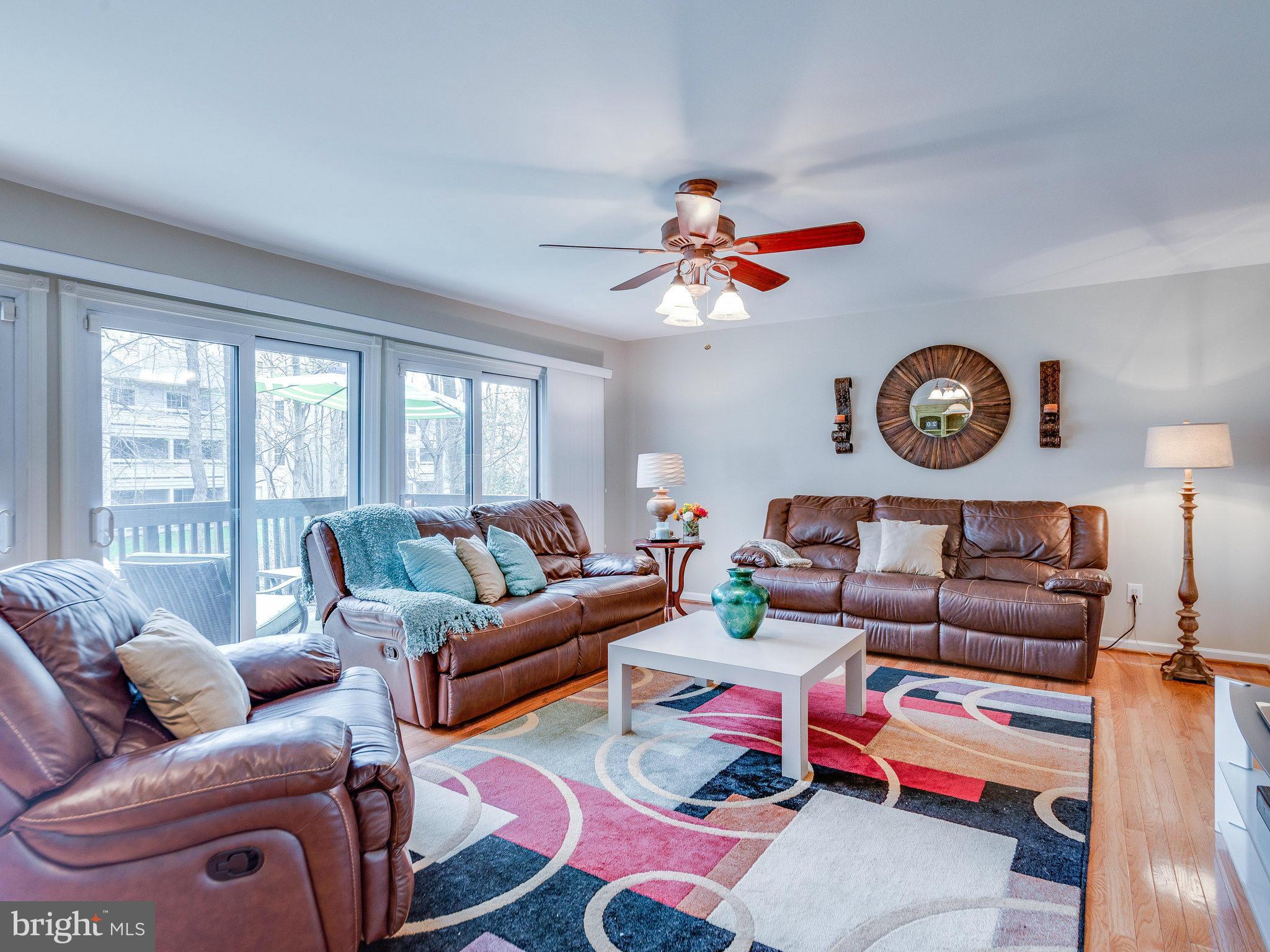 2269 Wheelwright Court Reston, VA 20191 - Photo 9 of 28 a living room with furniture a rug and a large window